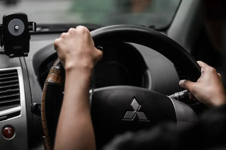 Driver with hands on the steering wheel